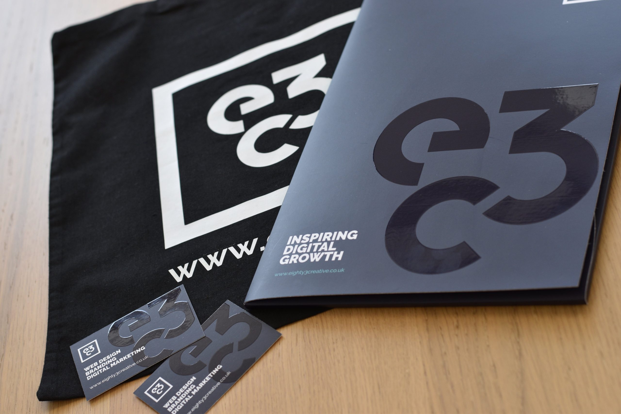 Brochures and business cards with Eighty3Creative branding